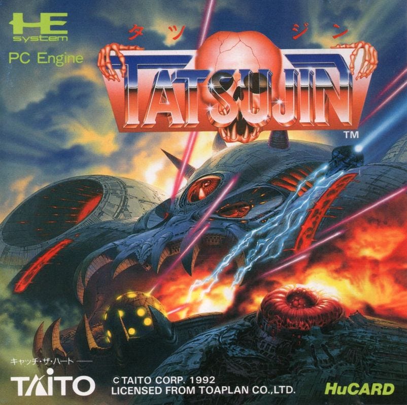 A scan of the box art for the Tatsujin port on the PC Engine, which even drew the skull logo with some amazing sharp teeth in the screaming skull at the center. A less cartoon-ish version of the enormous foe from the Genesis box art is present, made to look more realistic, and it's got an extremely ominous vibe that would fit perfectly on the cover of a thrash album from 1988. 
