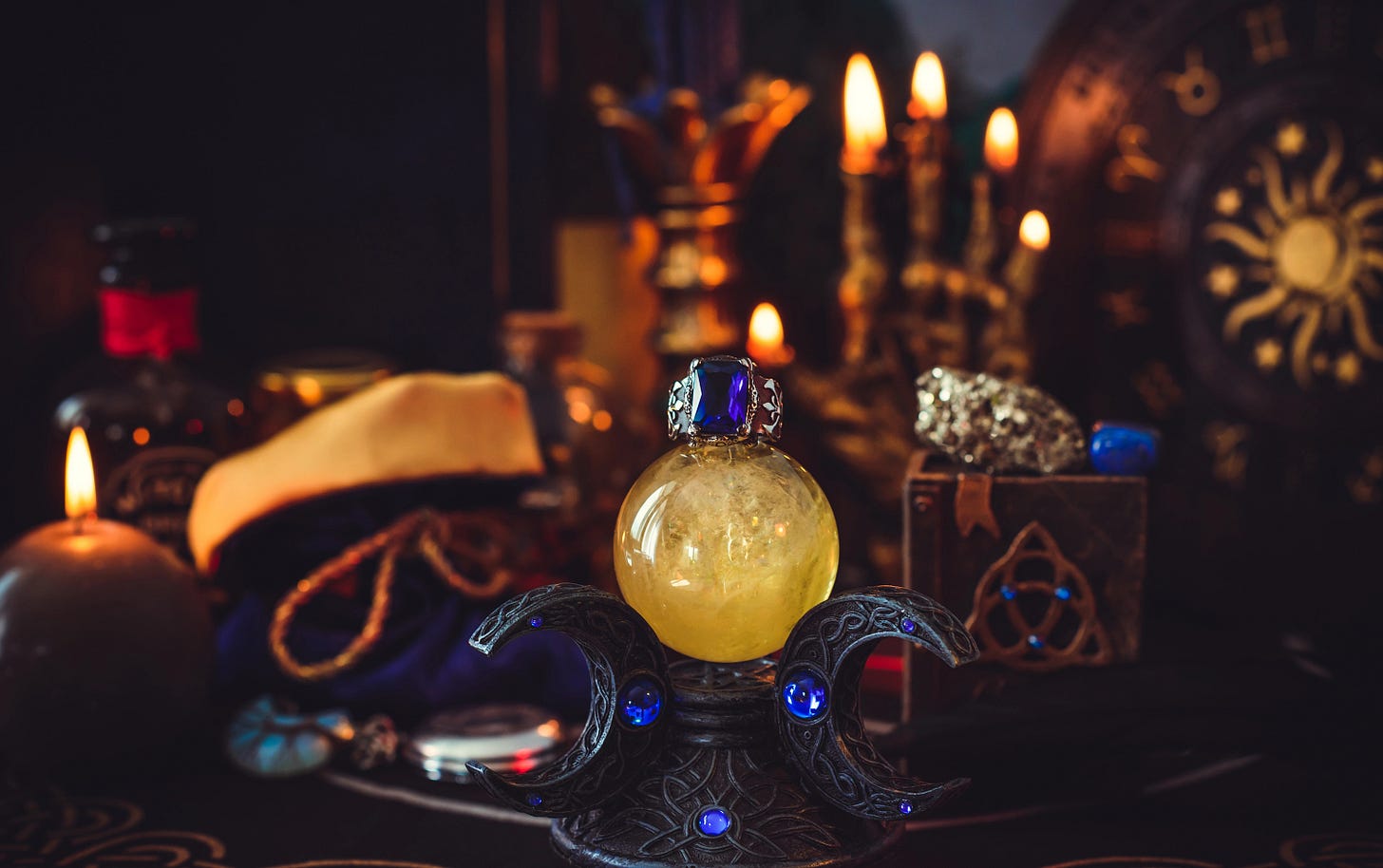 Scene set for ritual with crystals and candles and things