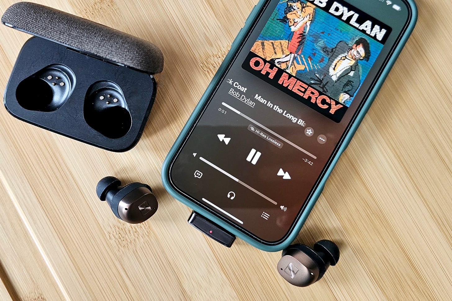 Questyle QCC Dongle Pro seen attached to an iPhone 16. Questyle QCC Dongle Pro seen attached to an iPhone 16.