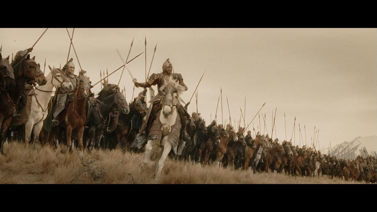 Epic battle scene from Lord of the Rings showing a cavalry charge