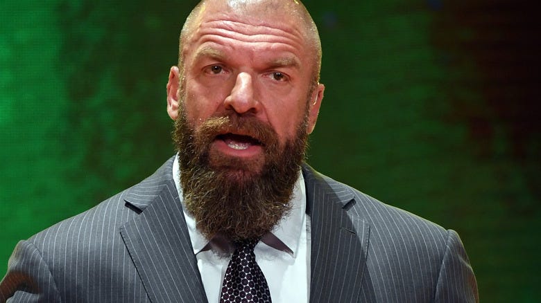 Triple H wearing a suit
