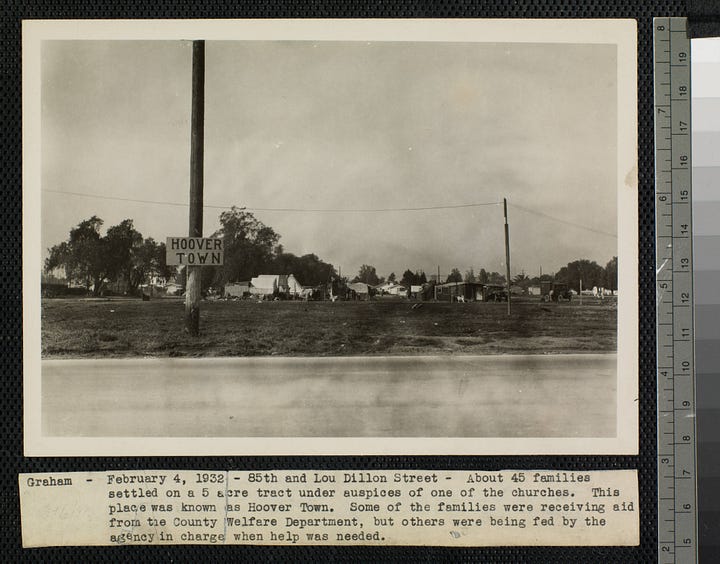 Description A view of a shack with a wooden frame and door, burlap sides, and a corrugated sheet metal roof. There are boxes and a seat outside of the hut, and roughhewn tables with tins and cans on them and pots hanging off the sides of them. One of the burlap sides was previously a sack for "Molasses red beet pulp". Description A view of a group of shacks on a lot in the Graham neighborhood of Los Angeles. Some of the huts are made with corrugated metal and wood, while others appear to be tents. A hand-painted sign reading "Hoover Town" is attached to a telephone pole in the foreground. There are a few people and a dog standing in the center of the lot and a car and truck parked on the right. There are permanent houses on the left and in the background.