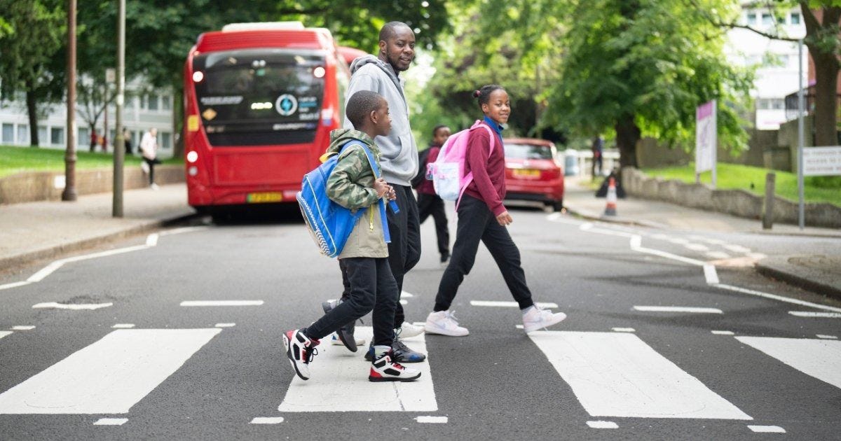 May be an image of 5 people, road and street