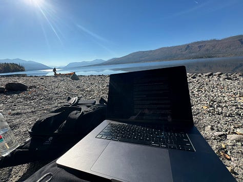 Images of Lake McDonald, left image of trees and mountains reflected on lake, middle computer with lake in background, right man carrying canoe to lake