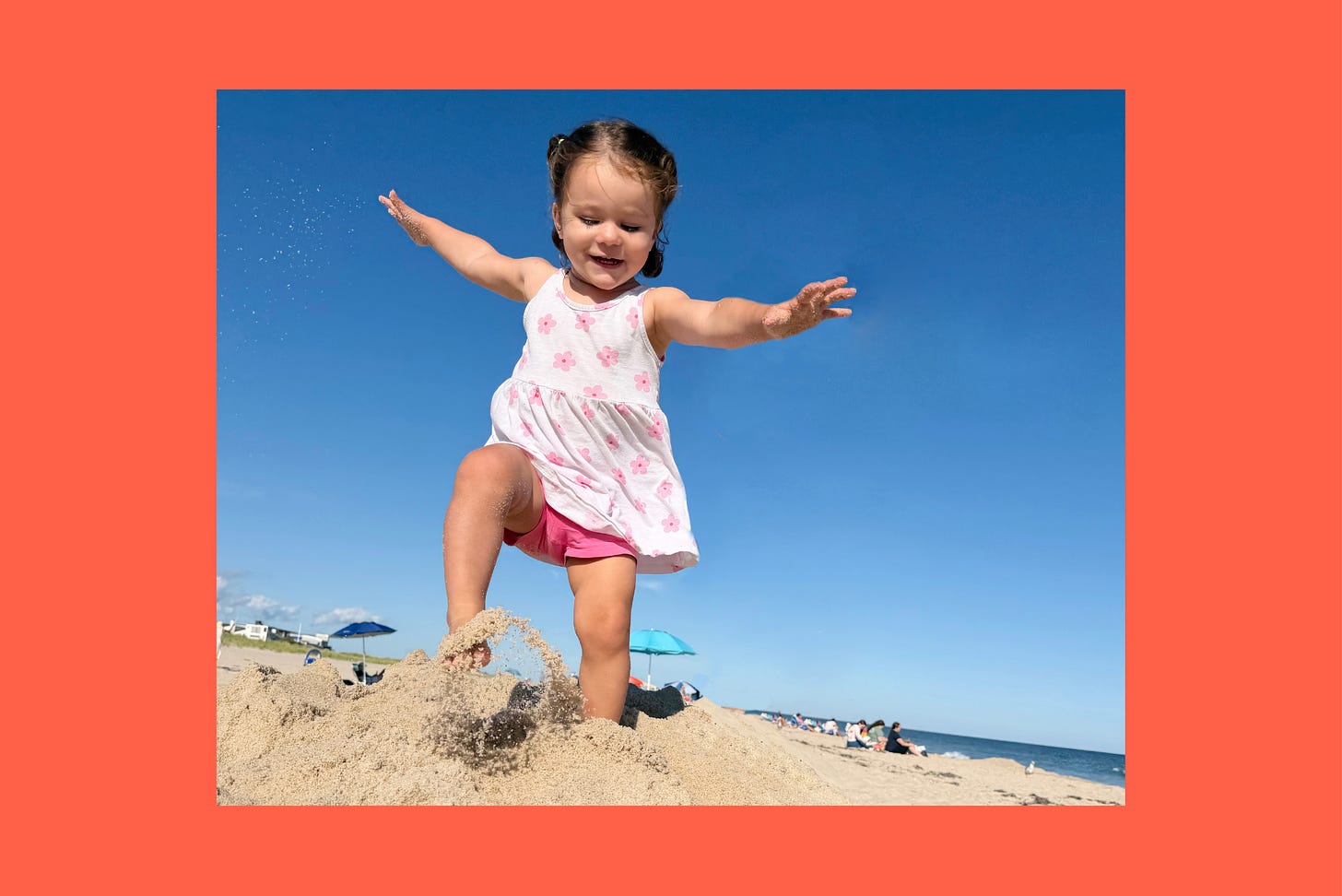 A two-year-old caught mid-jump, both feet off the ground. A two-year-old caught mid-jump, both feet off the ground.