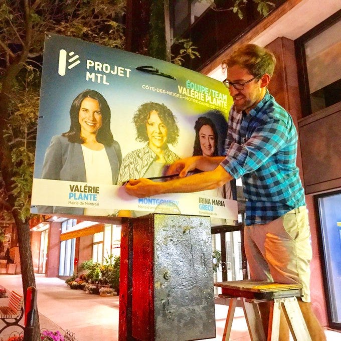 Chris hanging an election sign for Projet Montreal in 2017. Chris hanging an election sign for Projet Montreal in 2017.