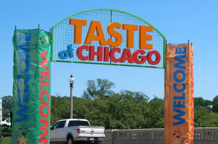 White pickup truck goes under a Chicago bridge near the Taste of Chicago