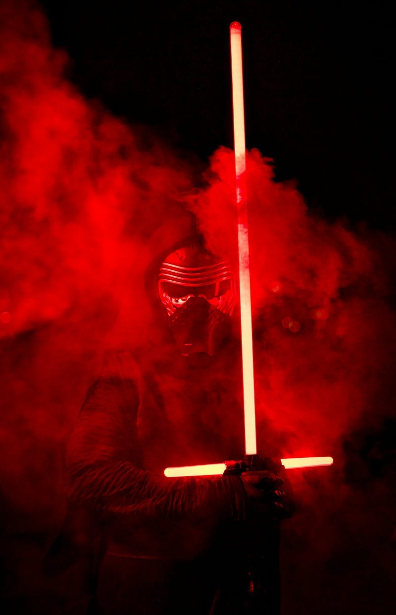 A sith holding a lightsaber