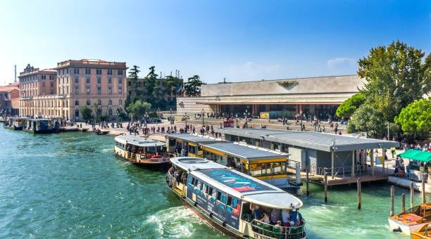 Santa Lucia Railway Station Ferries Tourists Grand Canal Venice Italy Santa Lucia Railway Train Station Public Ferries Ferry Stations Rapido Tourists Travelers Grand Canal Venice Italy venezia santa lucia railway station stock pictures, royalty-free photos & images
