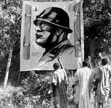 Eritrean Men saluting the image of Benito Mussolini in Ethiopia, 1936,  during the Second Italo-Ethiopian War. : r/PropagandaPosters