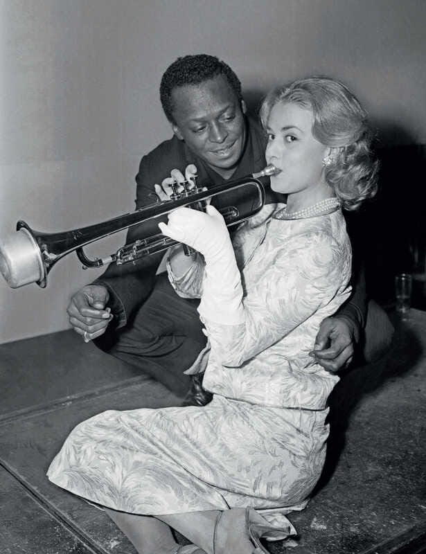 AFP | US trumpet player Miles Davis and French actress Jeanne Moreau in  Paris on December 5th, 1957. (1957) | Artsy