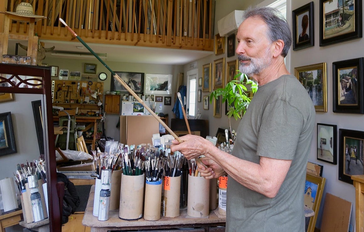 A person holding a paintbrush

Description automatically generated