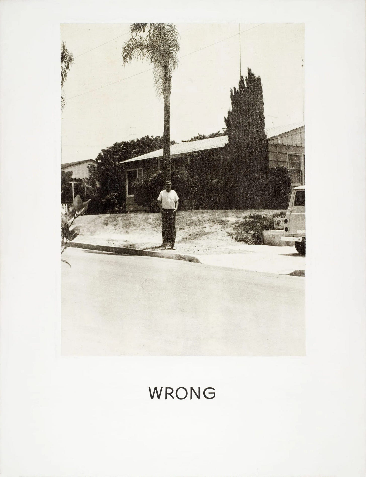 Print combining a grainy black-and-white photograph of a man standing on a suburban sidewalk with the word "WRONG" printed below in large uppercase letters Print combining a grainy black-and-white photograph of a man standing on a suburban sidewalk with the word "WRONG" printed below in large uppercase letters