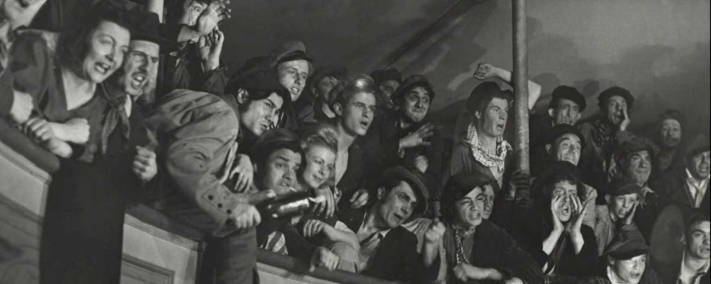 A group of people in a crowd

Description automatically generated