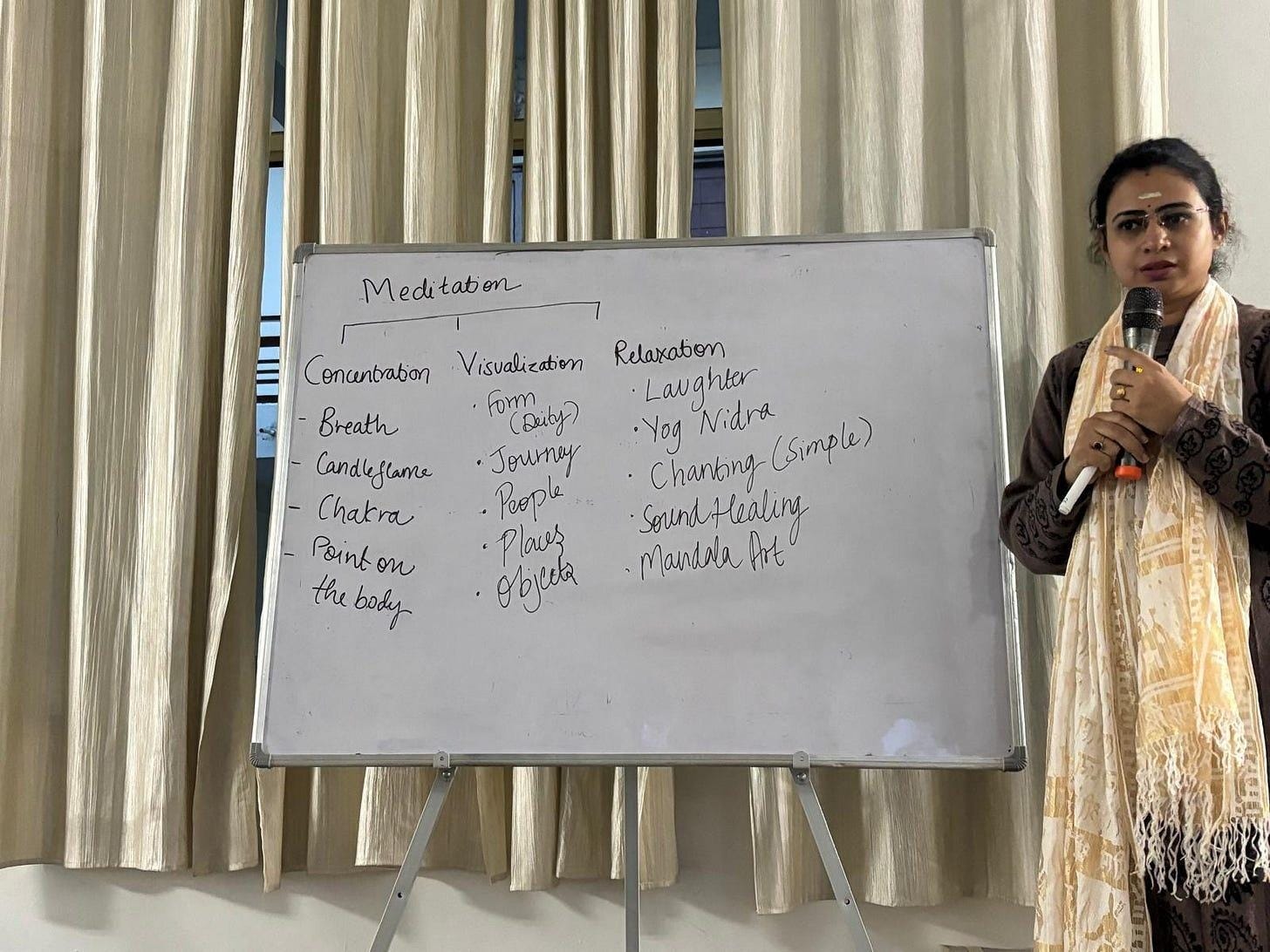 A person standing in front of a white board
Description automatically generated A person standing in front of a white board
Description automatically generated