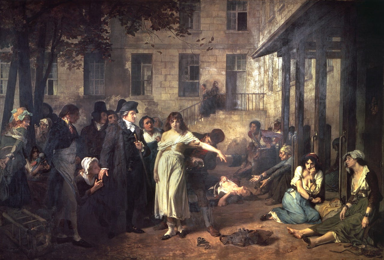 Doctor unchaining patients