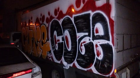 Graffiti on shops, building walls, trucks, underpasses and bus stops.