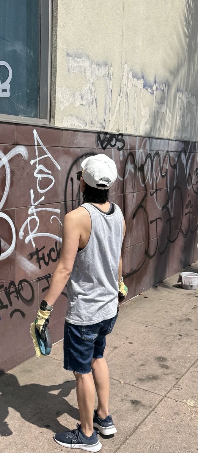 Author looking at a lot of graffiti.