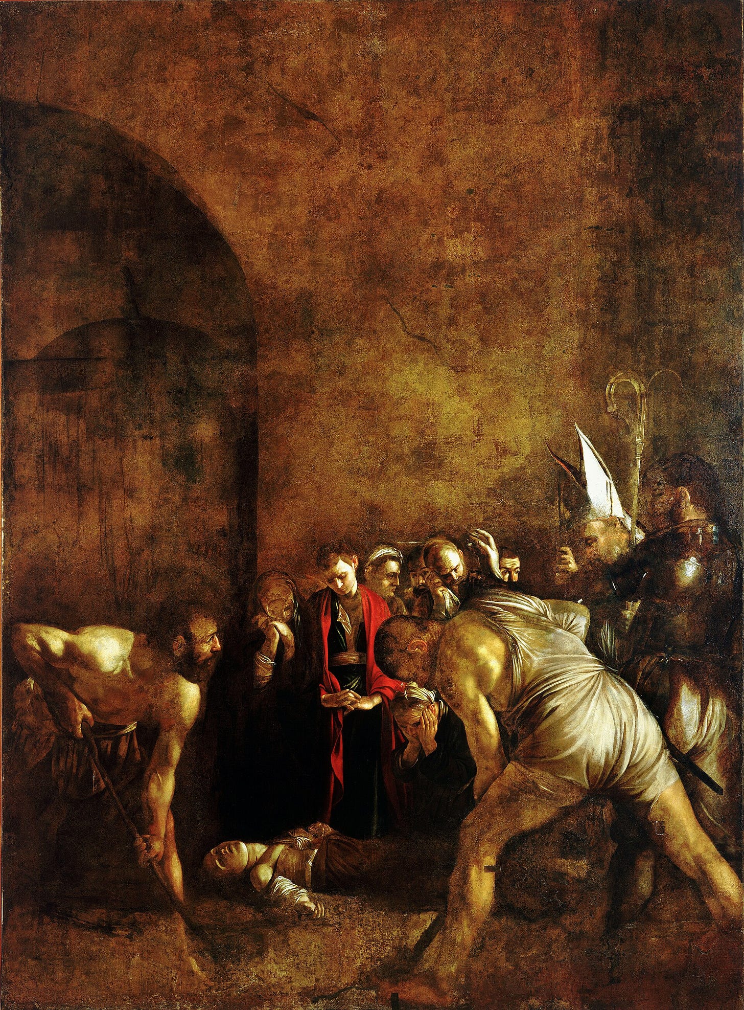 Under a vast bare wall pierced by a dark arch, two gravediggers bend over the body of a saint lying on the ground while mourners and a bishop with a raised hand look on.