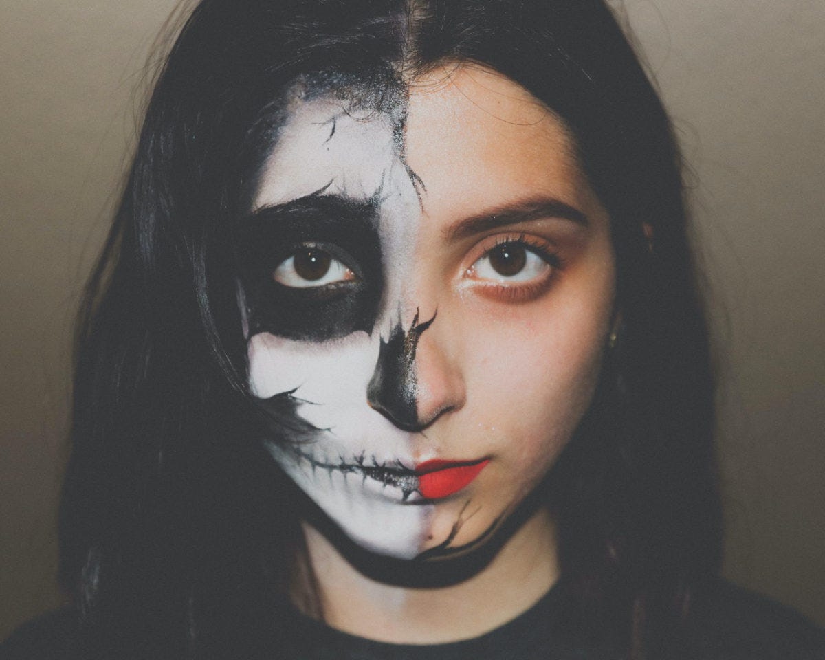 photo image of young woman with half painted face for the story OMG!! by author jenisecook.com