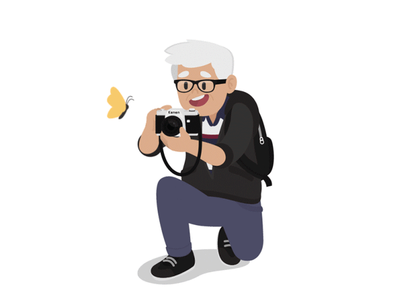 This may contain: an old man kneeling down with a camera in his hand and a butterfly flying above him