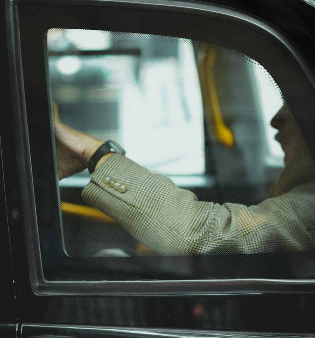 person sitting inside car