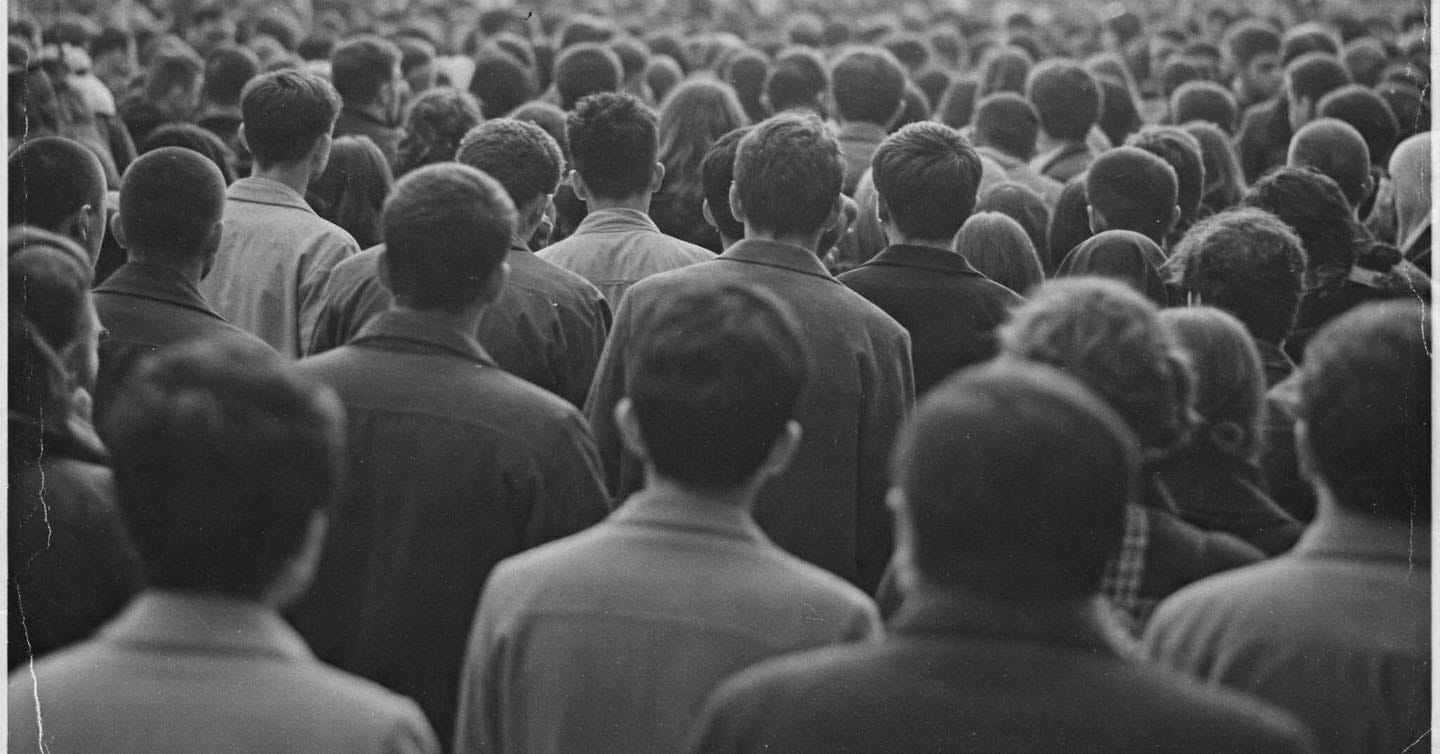 May be a black-and-white image of 1 person and crowd