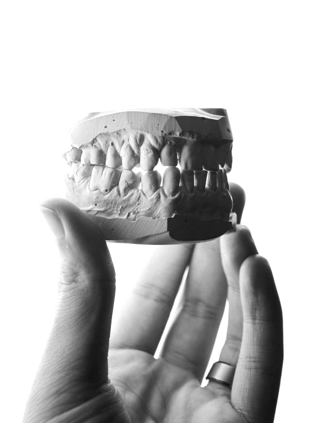 person holding brown and white round ornament