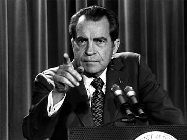 Black-and-white photograph of U.S. President Richard Nixon announcing economic measures during the Nixon Shock, symbolizing the breakdown of the Bretton Woods system and a major shift in the global monetary regime. Black-and-white photograph of U.S. President Richard Nixon announcing economic measures during the Nixon Shock, symbolizing the breakdown of the Bretton Woods system and a major shift in the global monetary regime.