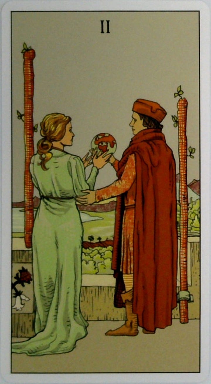 The Two of Wands tarot card and the Explore Fullness oracle card.