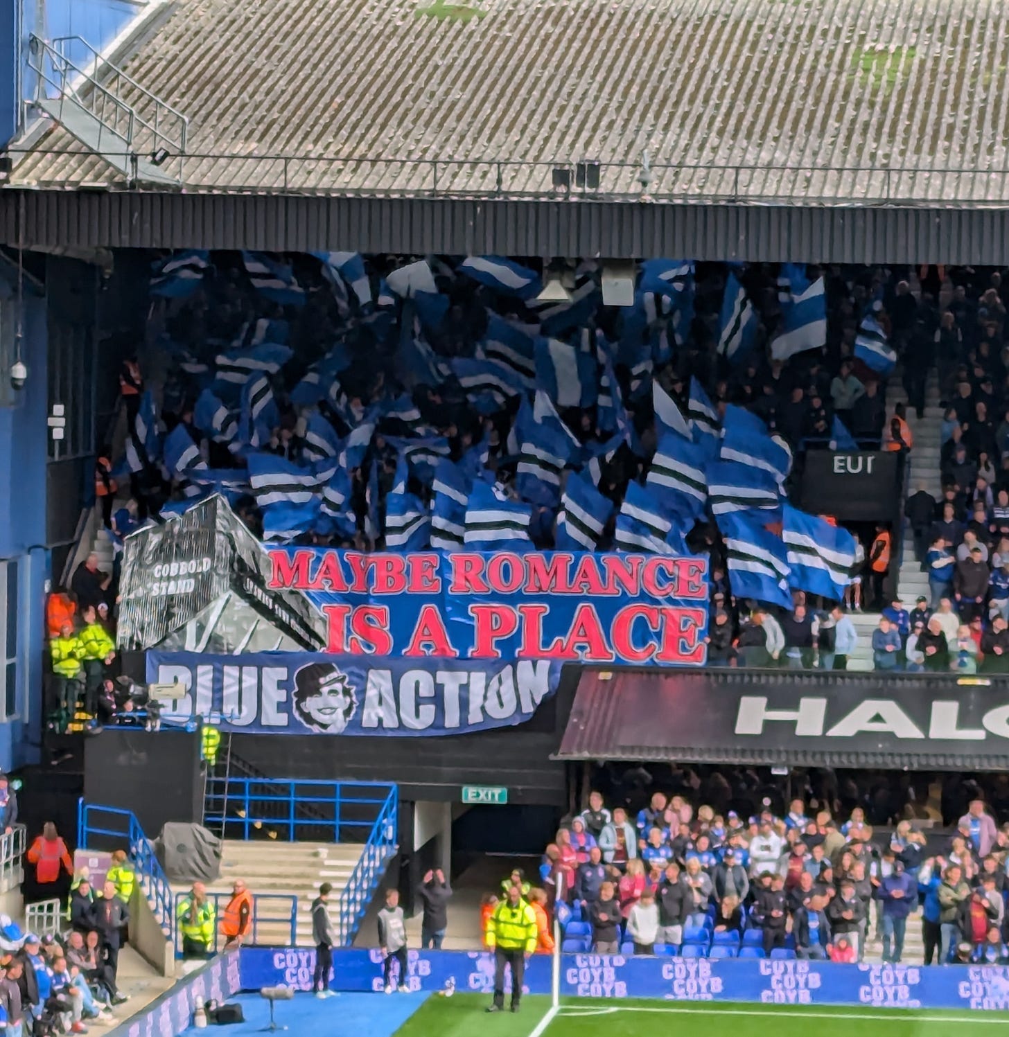 Pre-match tifo by Blue Action - reads "Maybe Romance is a Place"
