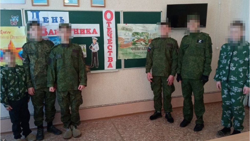 Ukrainian children wearing Russia military uniforms Ukrainian children wearing Russia military uniforms