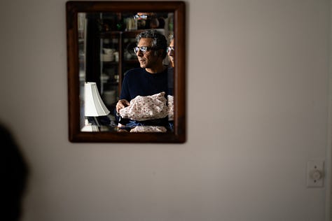person holding fabrics photographed in the mirror, stylish model wearing a khadi suit, two people walking away wearing khadi pants