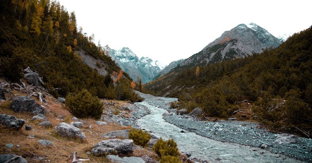 wide angle photo of river and mountain