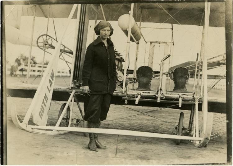 Aviator Ruth Law in front of her monogrammed Wright Model B airplane. Aviator Ruth Law in front of her monogrammed Wright Model B airplane.