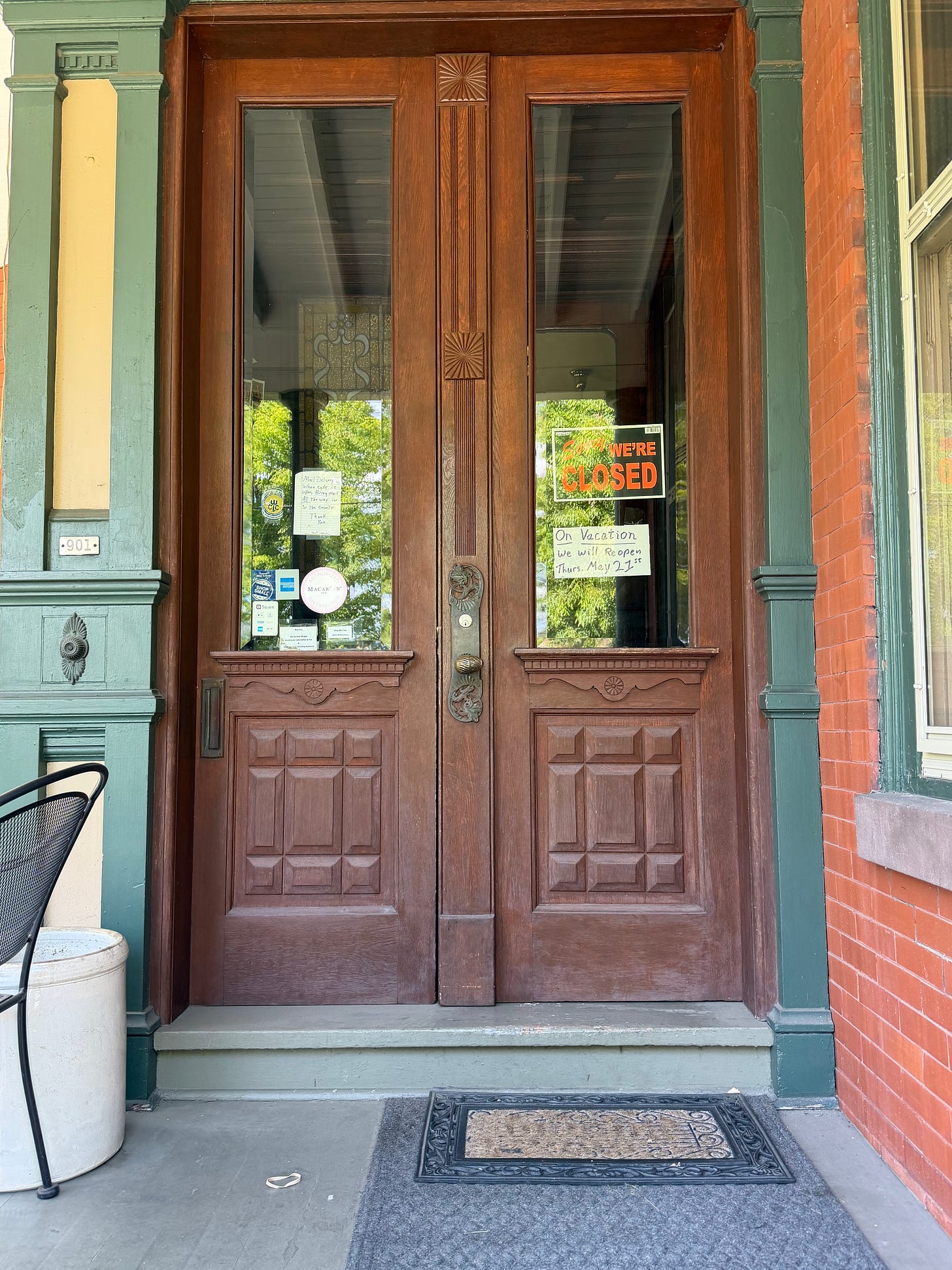 A wooden door with a "Sorry, We're Closed" sign on it A wooden door with a "Sorry, We're Closed" sign on it