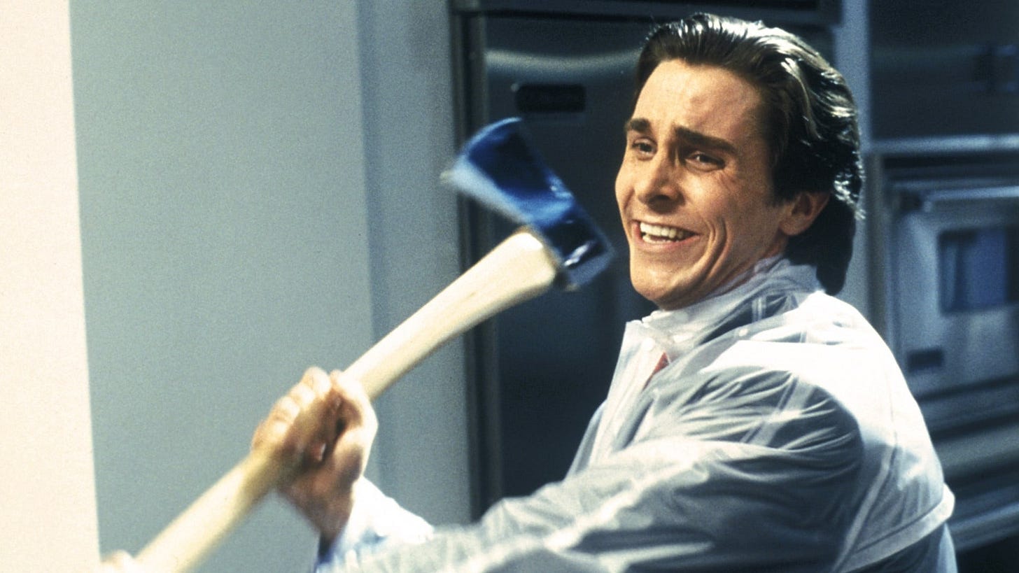 American Psycho | Still features Christian Bale as Patrick Bateman wielding an axe while giving a menacing smile.