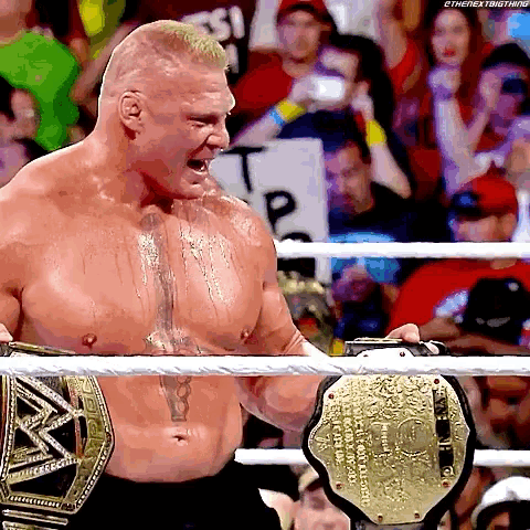 a shirtless wrestler holding a world heavyweight wrestling championship belt