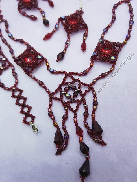 Closeups of a deep red beaded necklace with glass beads