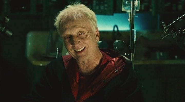 John Kramer, also known as Jigsaw, delivers a calm, eerie smile — a chilling contrast to the gruesome morality games he orchestrates in the Saw franchise.