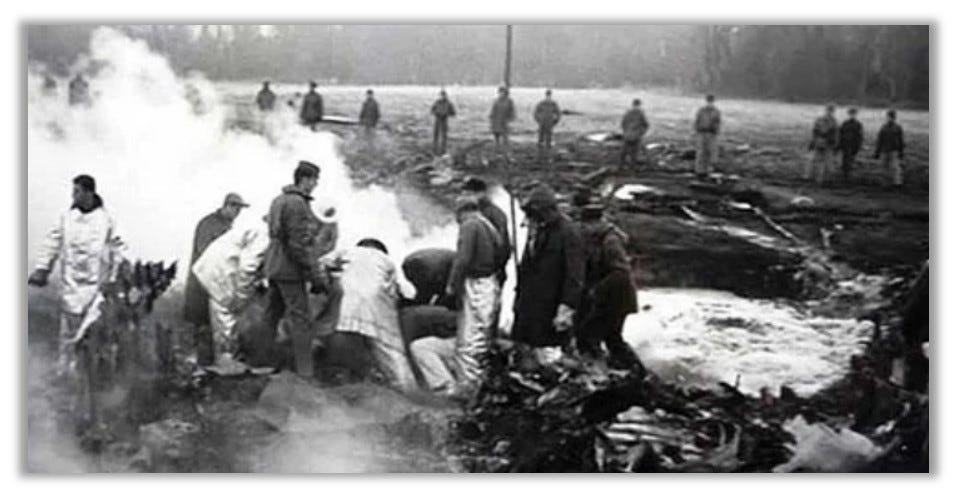 Crews are shown hard at work  around a hole in 1961