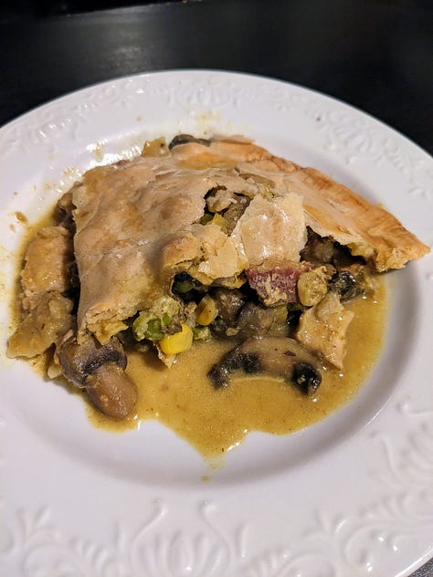 uncooked savory pie with chicken and mushroom filling; golden crust of a baked pie, slice of savory pie with gravy running out of it