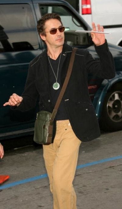 Image may contain Robert Downey Jr. Sunglasses Accessories Accessory Human Person Clothing Apparel and Wheel