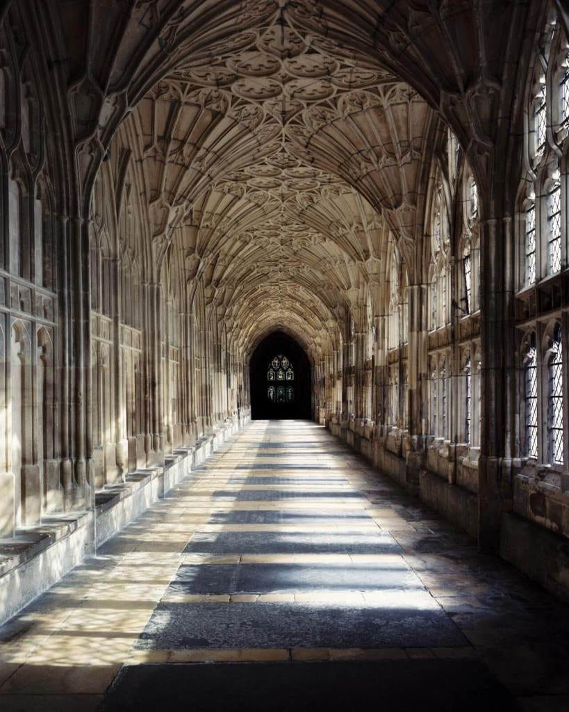 At Gloucester Cathedral, the window design has been extended into the cloister. At Gloucester Cathedral, the window design has been extended into the cloister.