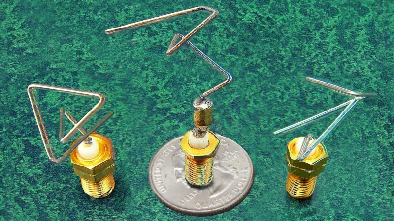 Picture of three separate, strangely shaped pieces of wire, each mounted on a threaded base. The middle one is standing on a US quarter dollar piece, and is of a similar size. Picture of three separate, strangely shaped pieces of wire, each mounted on a threaded base. The middle one is standing on a US quarter dollar piece, and is of a similar size.