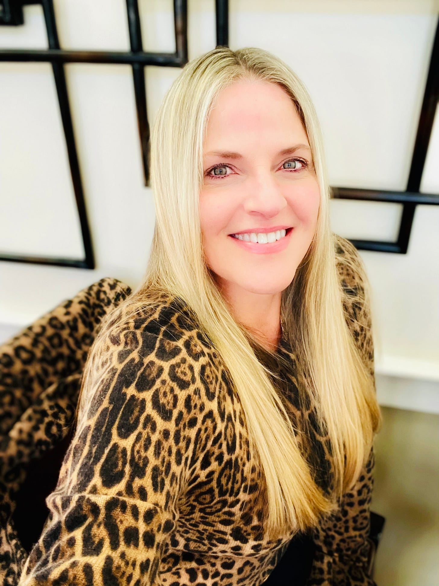 Kelly E. Keough in leopard sweater