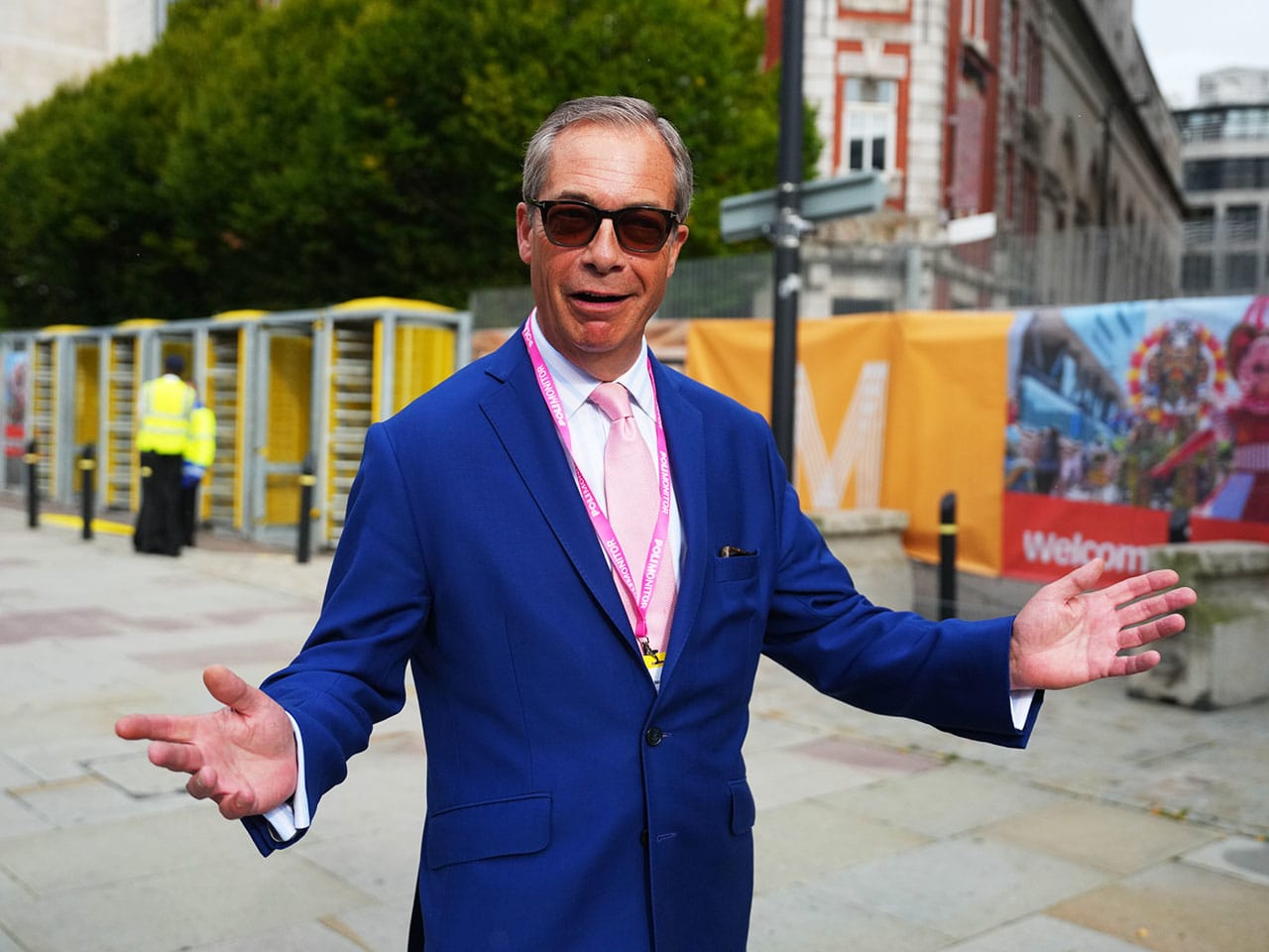 image of Nigel Farage wearing a bright blue suit