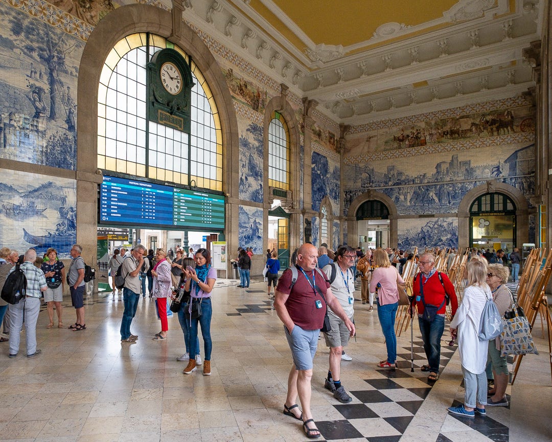 The inside of a train station with walls richly decorated with Portuguese azulejos The inside of a train station with walls richly decorated with Portuguese azulejos