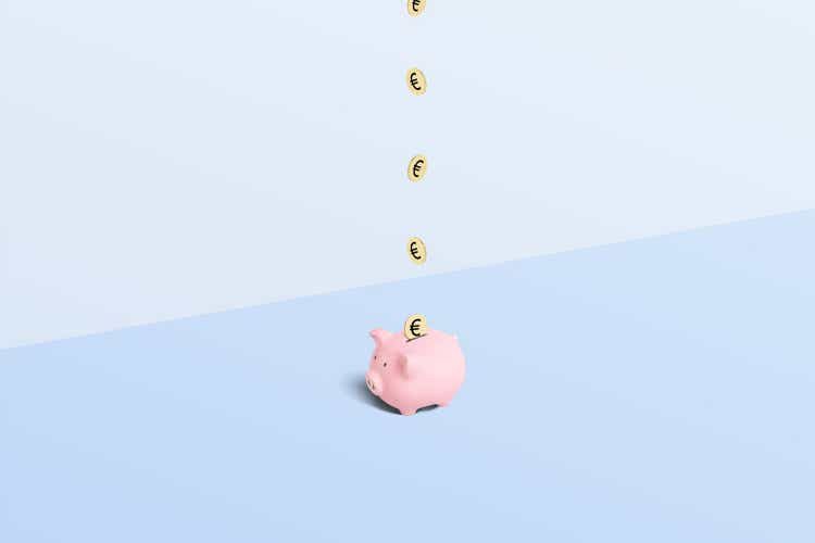 Piggy bank with gold euro coins