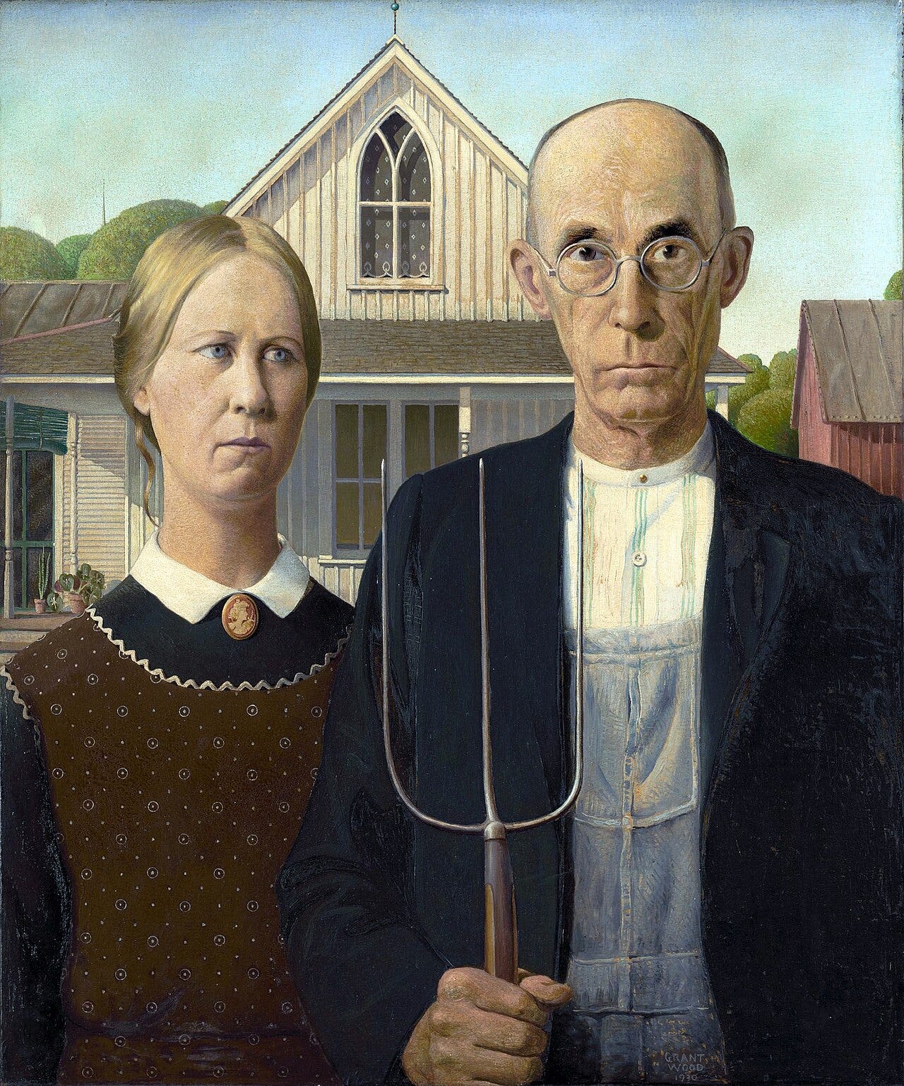 A stern farmer holds a pitchfork beside a woman in front of a white farmhouse A stern farmer holds a pitchfork beside a woman in front of a white farmhouse